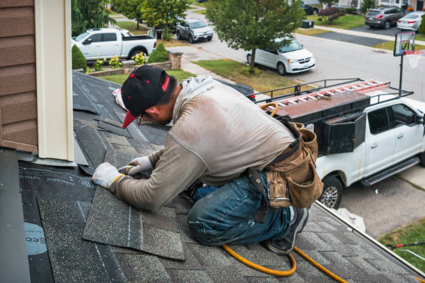 Professional Roof Replacement technician working in Wilmington, MA